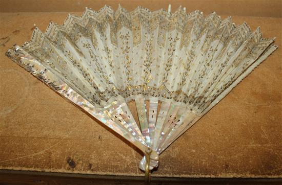 Late 18th century French pierced ivory and painted fan & a gold sequinned fan (2)(-0